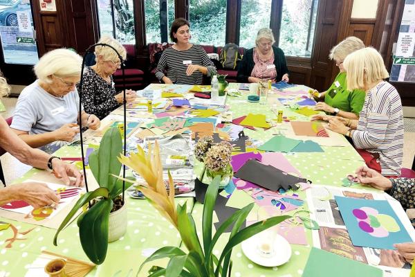 Art group around table at work