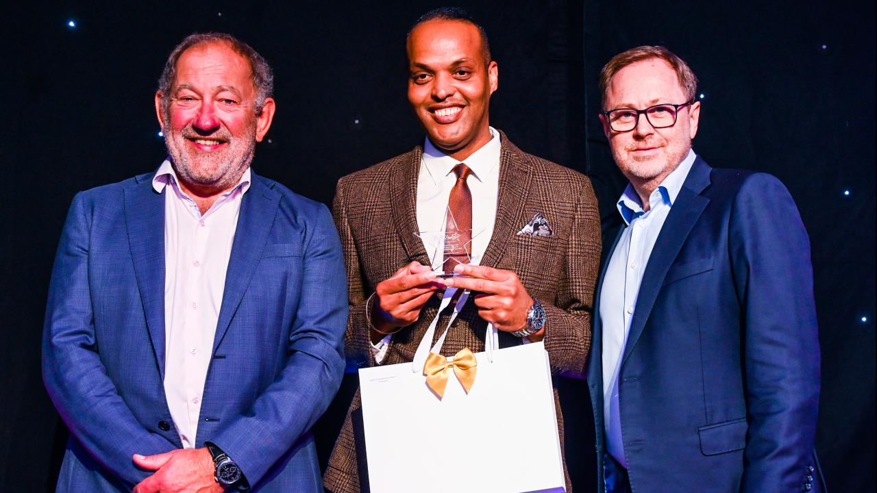 Mervyn receiving his award