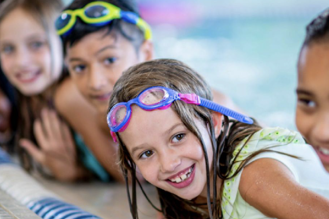 Child smiling in the pool
