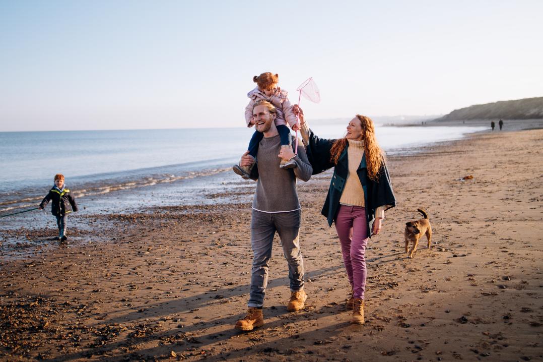 A family enjoying time on the beach
