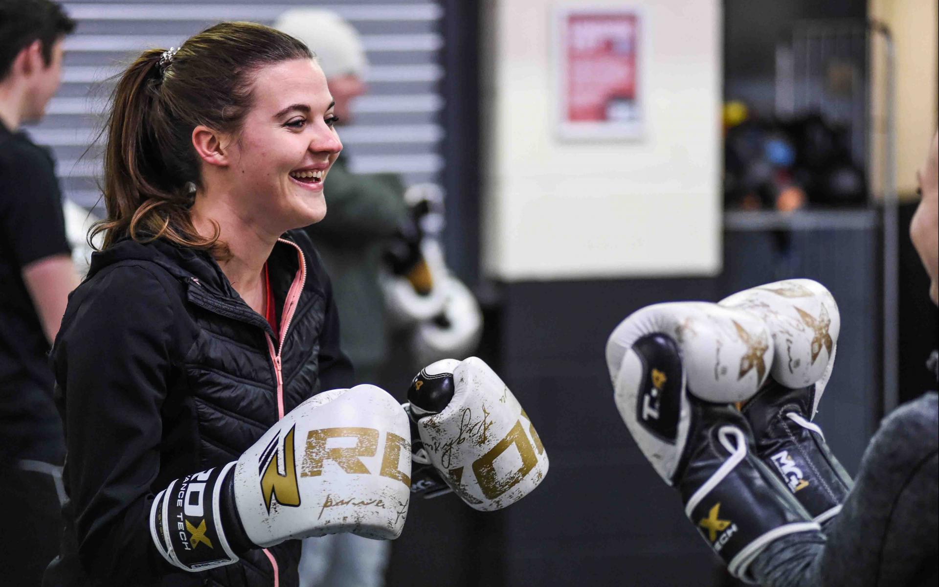 Young women boxing smiling