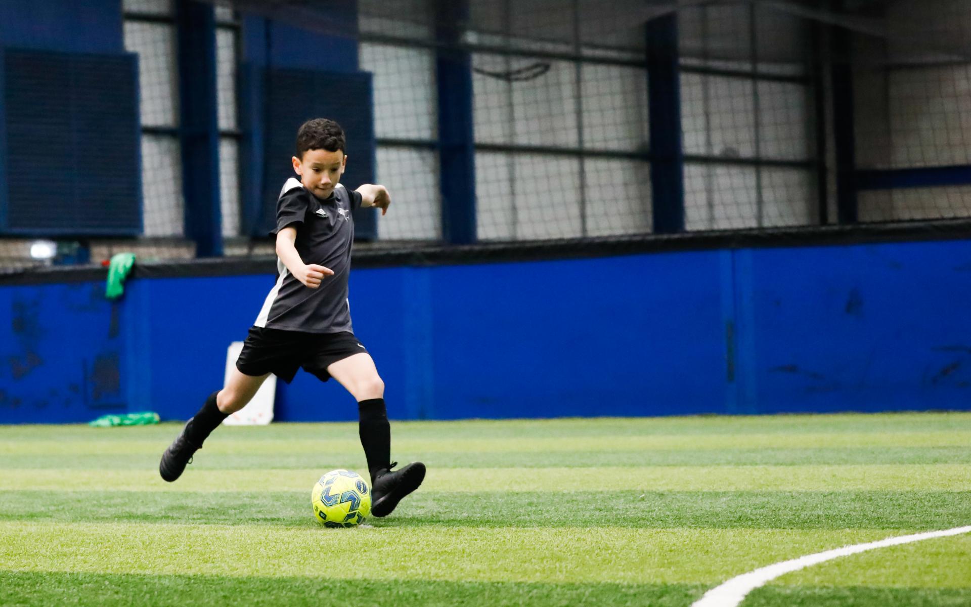 Child playing football