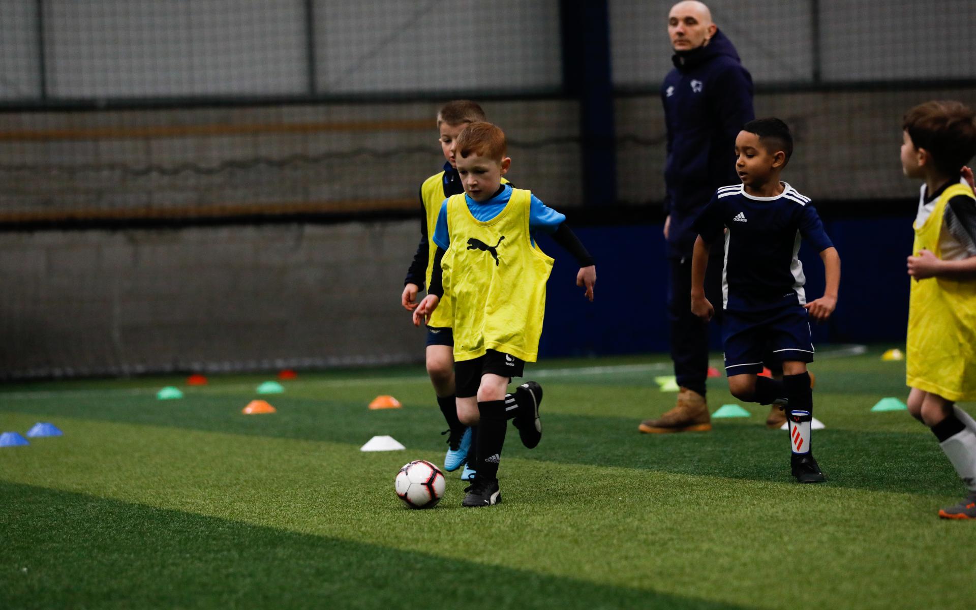 Child playing football