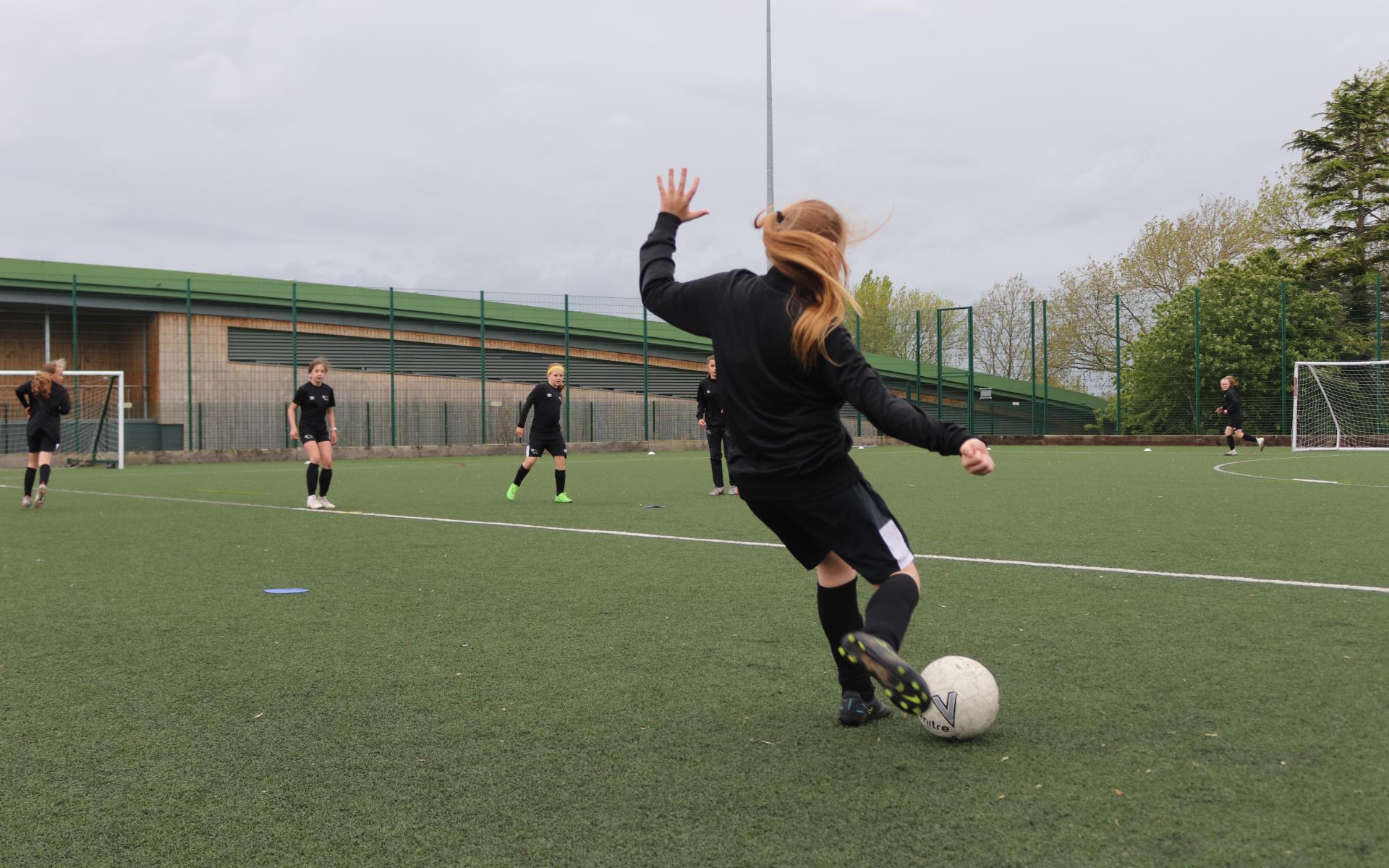 Girl playing football