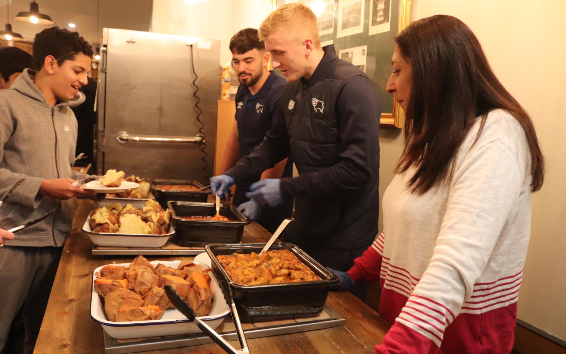 Eiran Cashin and Louie Sibley help out at Community Meals