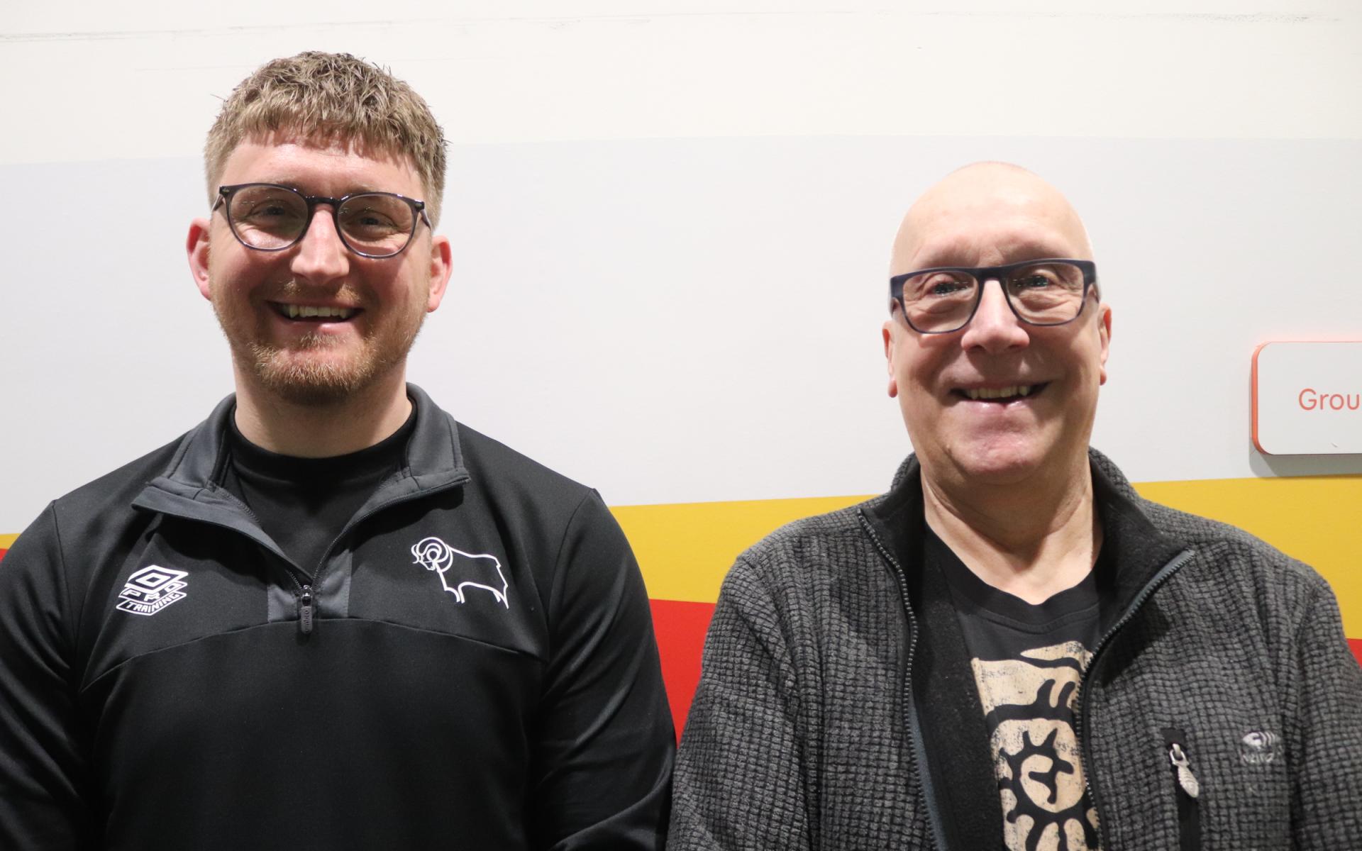 Participant Neil smiles along side DCCT staff member Adam.