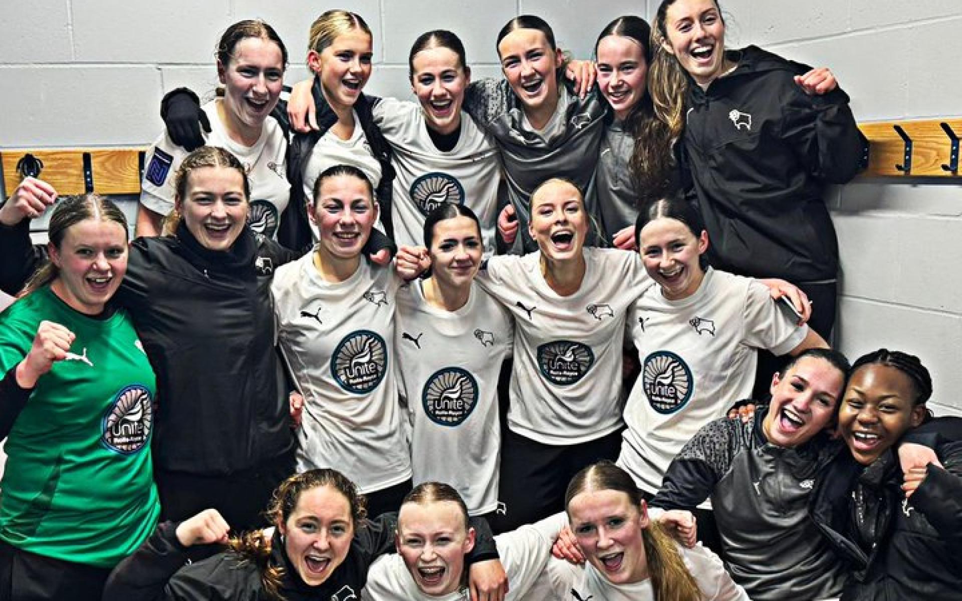 The team celebrating their win