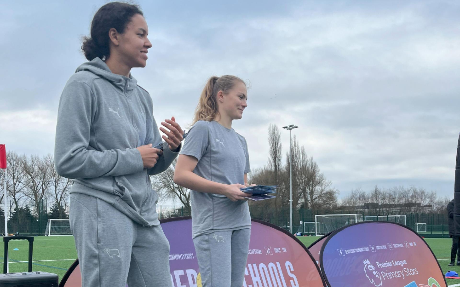 Derby County Women's footballers Paris and Helena hand out certificates at girls football event