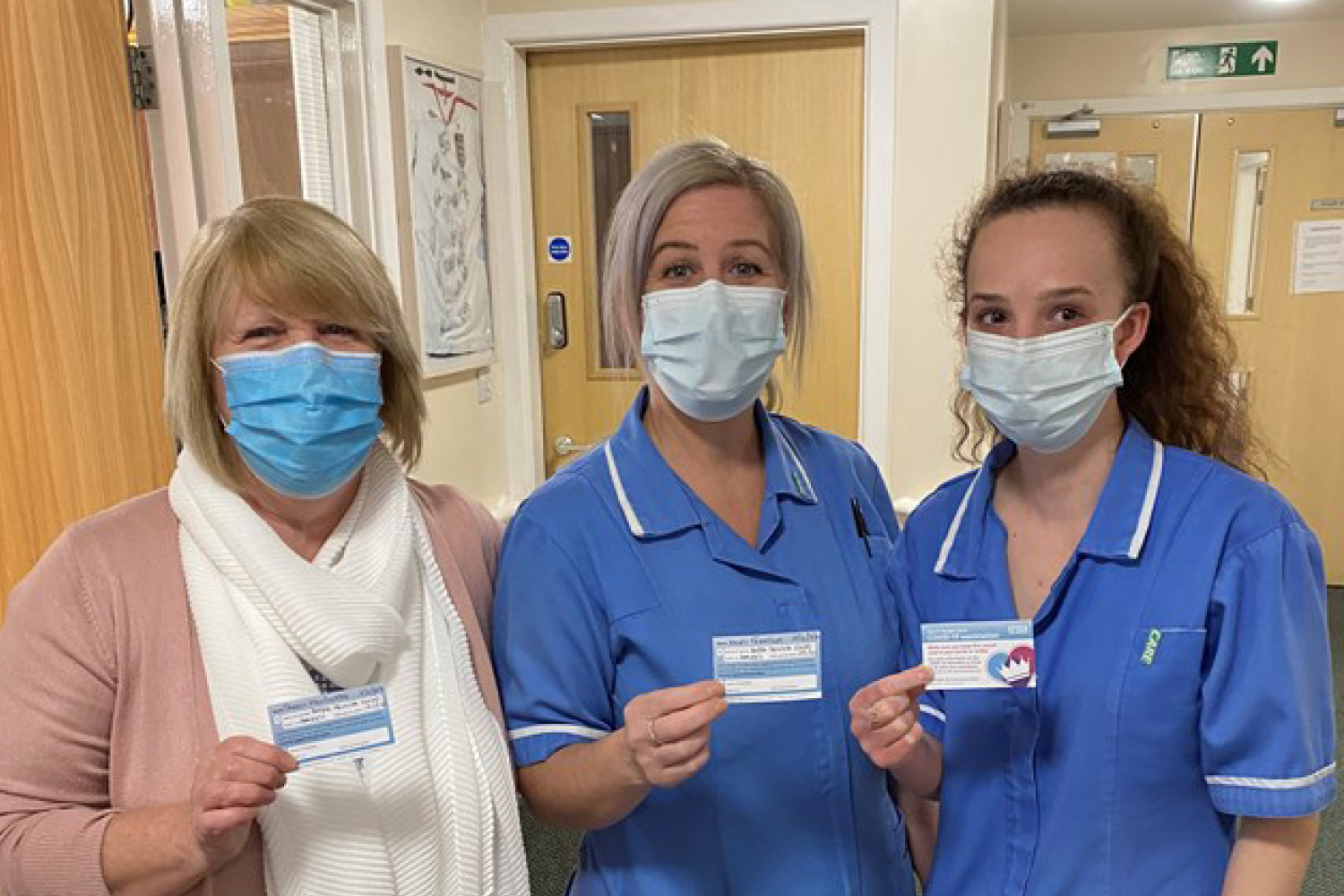 Colleagues receiving the COVID-19 vaccine