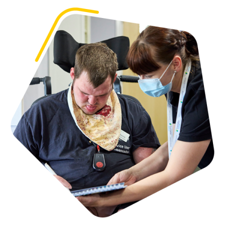 OT with care home resident using a tablet