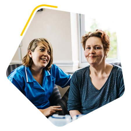 Female service user sat with carer
