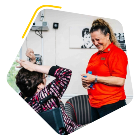 Female service user playing with care worker