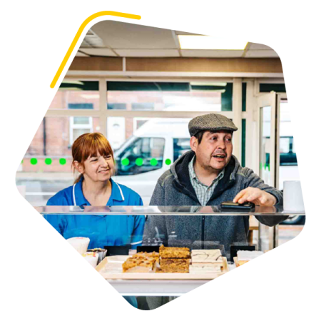 Male service user at the counter in a shop