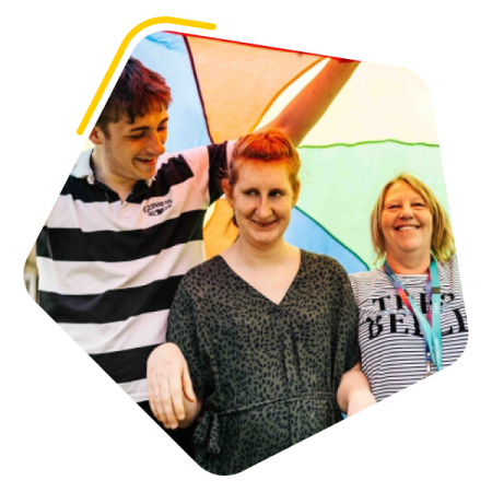 Woman with a learning disability stood under a kite