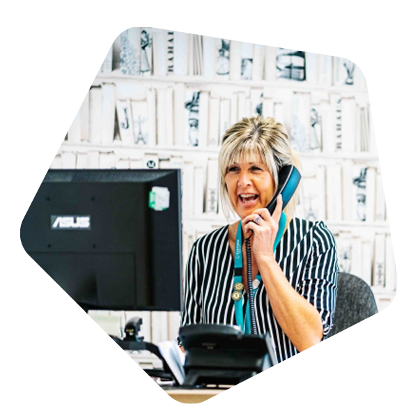 Female Manager sat on the phone