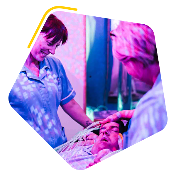 Women with carers in a sensory room