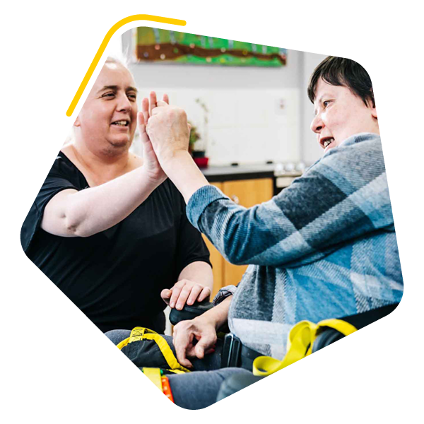 Care home resident with care worker