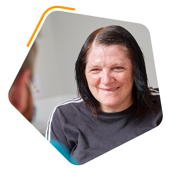 Female service user smiling at camera