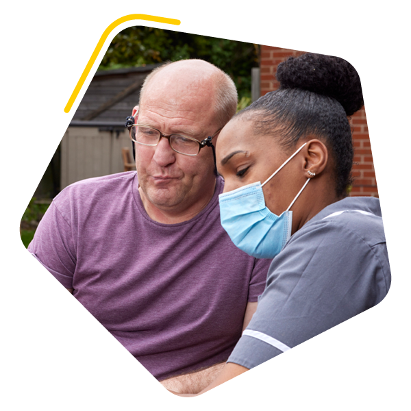 Care home resident with care worker