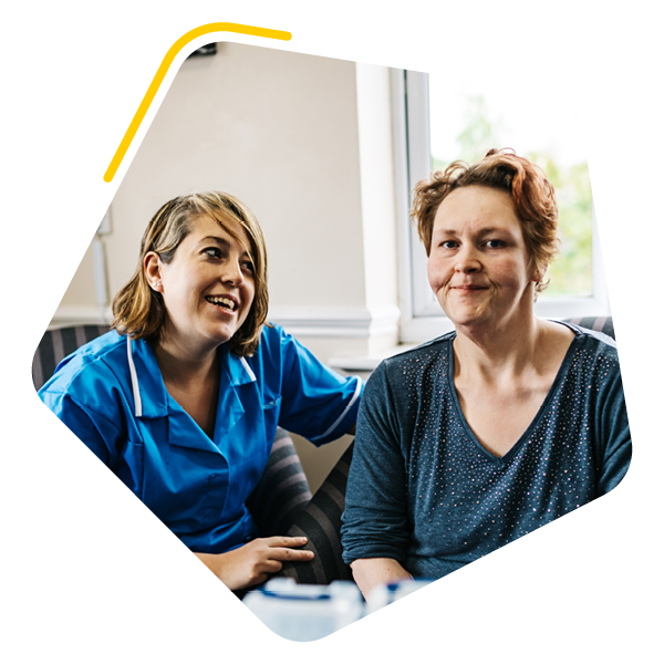 Female service user sat with care worker