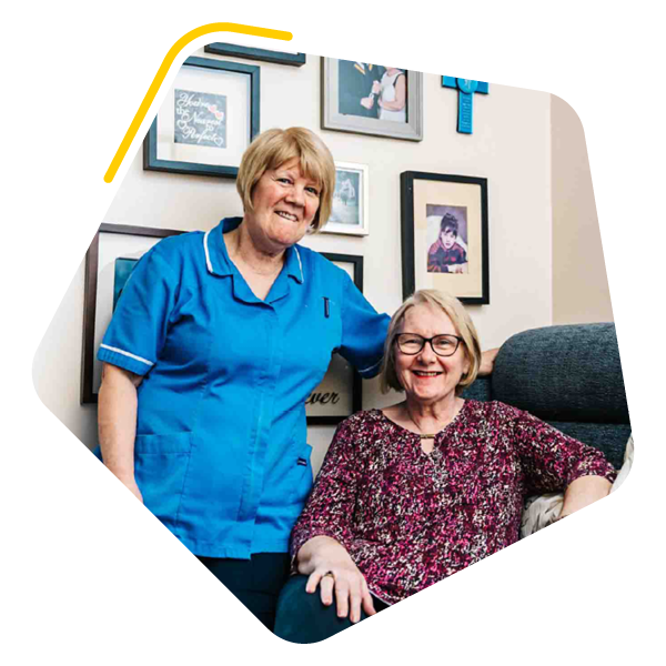 Female care home resident with care worker