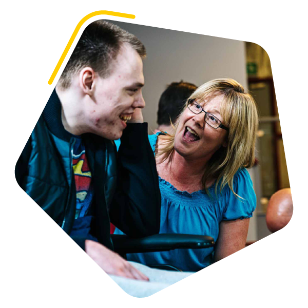 Mum with disabled son in a bowling alley