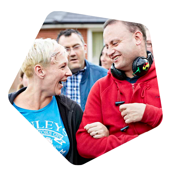 Male service user with a learning disability walking outside
