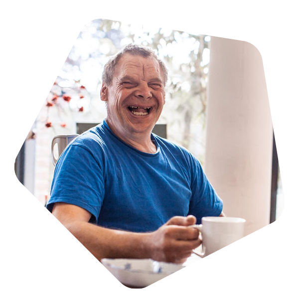 Man sat with a cup of tea