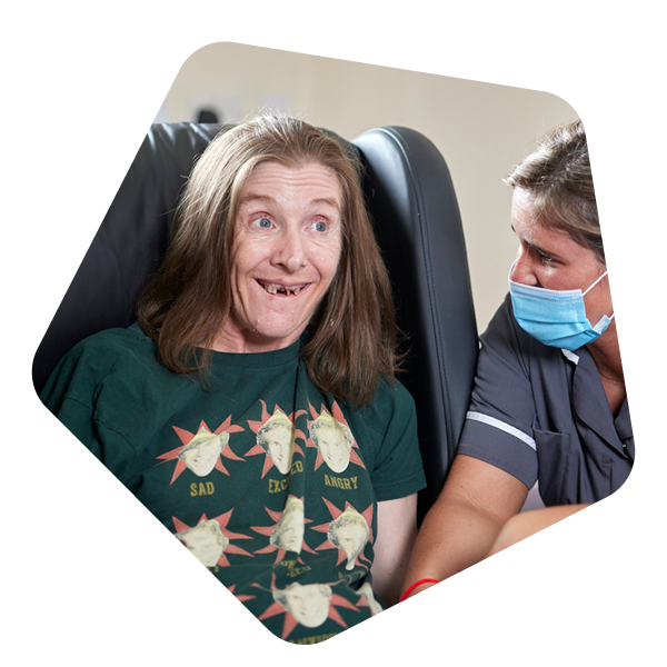 Female service user with carer in christmas jumper