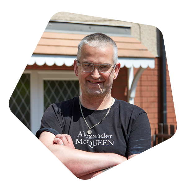 Male service user stood outside his house