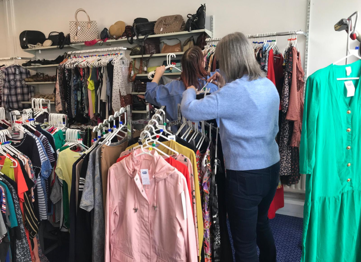 Volunteers sorting donations at a charity shop