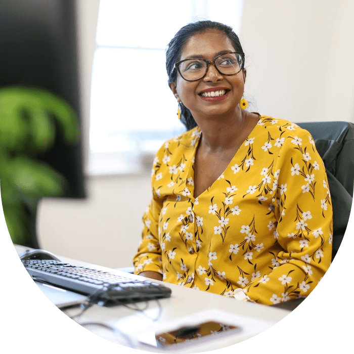 Smiling woman in a yellow blouse