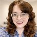 lady with brown hair and glasses
