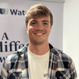 Young white male wearing a checked shirt
