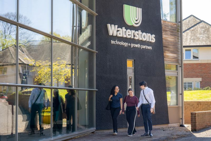 Colleagues walking outside waterstons office